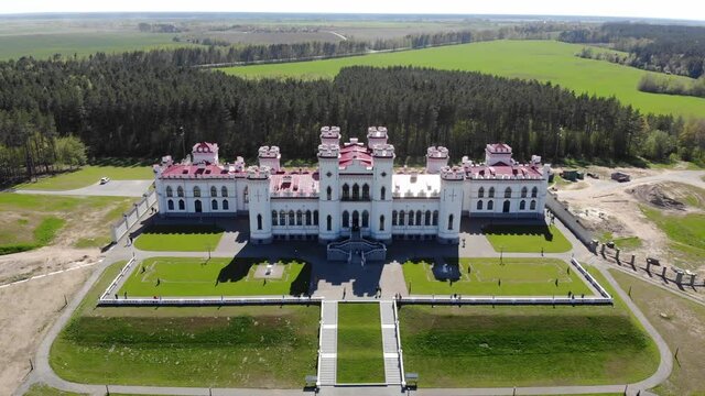 View on the old castle-palace Puslovsky, national landmark. Kossovo, Belarus. Aerial video 4K