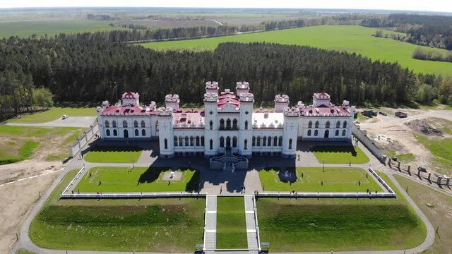 View on the old castle-palace Puslovsky, national landmark. Kossovo, Belarus. Aerial video 4K