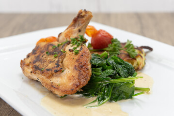 Roasted chicken breast served with spinach and hash to fulfill that big appetite