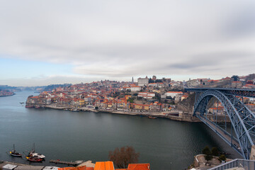 Oporto, Portugal, Europe. Postcard from the picturesque city of Porto, amazing travel destination in Portugal. View to the historic center of the city, Douro River with its beautiful bridge a