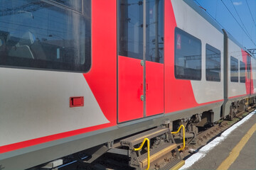 High-speed passenger electric train on the platform close-up.