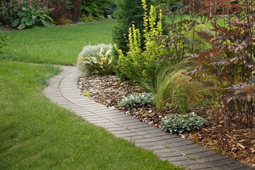 Backyard Garden Modern Design Landscaping. Decorative Garden Winding Pathway Walkway From Black...