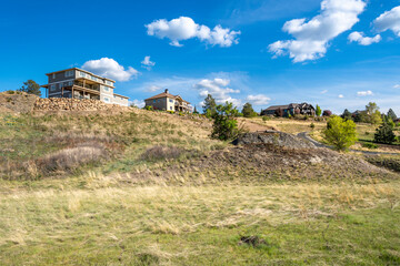 A new construction home alongside existing luxury homes on top of a hill in the city of Liberty Lake, Washington, a suburb of Spokane, Washington USA