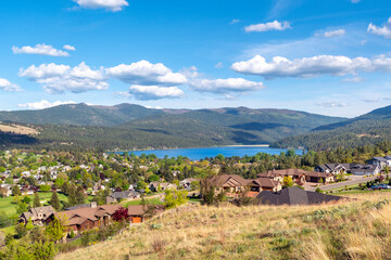 Fototapeta na wymiar Hilltop view from a luxury subdivision of the lake and city of Liberty Lake, Washington, a rural suburb of Spokane, Washington, USA