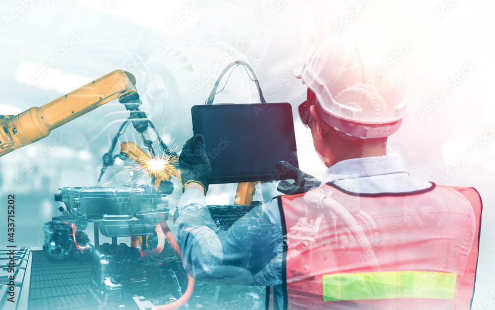 Poster mechanized industry robot arm and factory worker double exposure . concept of robotics technology fo