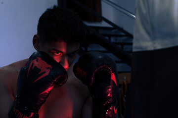 Fototapeta na wymiar Latin boxer training boxing in the gym