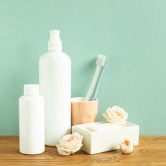 Fototapeta na wymiar Skin care and spa concept. Bathroom bottle and toothbrush, soap on wooden shelf