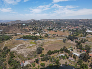 Fototapeta na wymiar Aerial view of Lakeside suburb town with mountain on the background, San Diego, Southern California, USA 