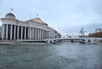 Eye Bridge and behind the Archaeological Museum in Skopje, Macedonia. Eye bridge began construction in 2011.