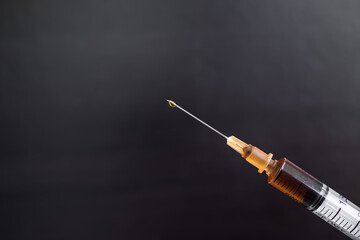 Heroin in Syringe on black backgroung. dope, opiate, Addictive substance, habit-forming substance,...