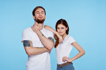 young couple in white t-shirt fashion modern style blue background