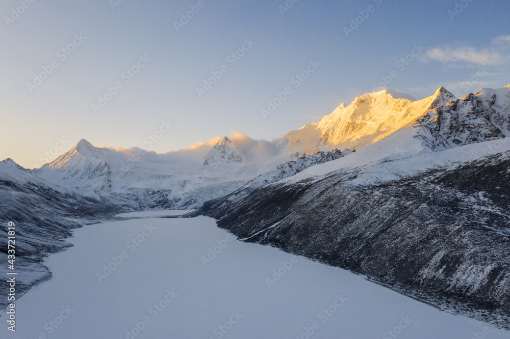 Poster aerial view of snow mountain sunrise landscape