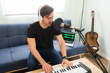 Hispanic composer singing with a microphone