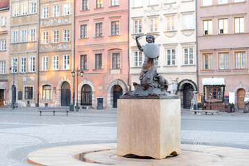Old town in Warsaw, Poland. Mermaid symbol of the city. Syrenka with a sword. © Availaisu