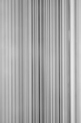Obraz premium Merging Vertical Lines Black and White Background (focus on the center line)