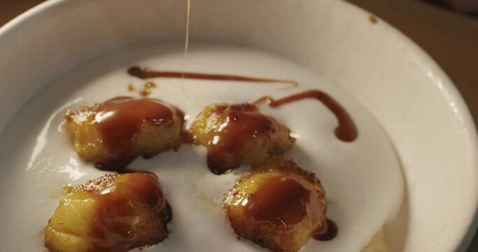 The chef adds tender caramel on top of the airy coconut white mousse cream with sauteed bananas