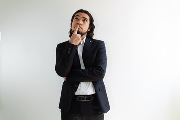 Hispanic man with long hair with a very pensive attitude on a white background