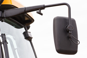 Mirror in car, truck, tractor or other machine. Safety while driving. Transportation