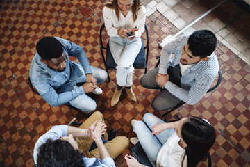 Young people sitting in a circle and having a discussion