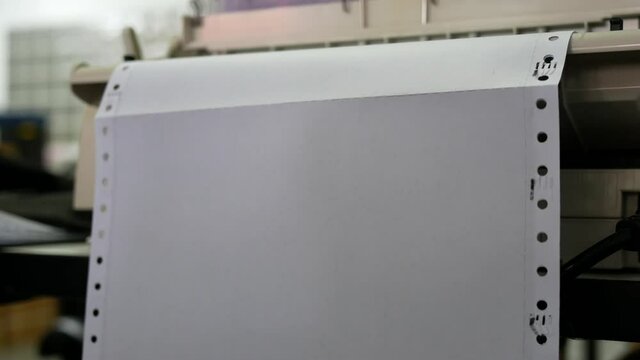 closeup of continuous paper printer in the office.