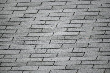 close up on gray roof shingle background