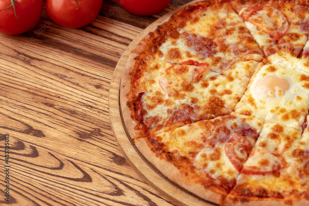 Wall mural freshly baked pizza on table close up