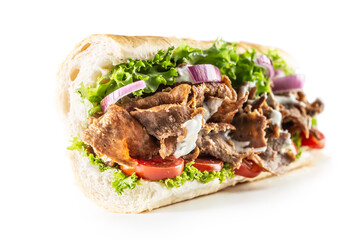 Isolated Turkish kebab baguette with generous portion of vegetables and properly grilled veal or chicken meat