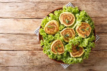 Food Fleischschnacka French Alsatian dish made from cooked meat stuffing rolled in a fresh egg pasta close-up in a plate on the table. Horizontal top view from above