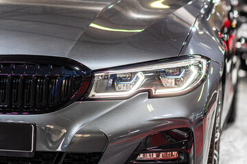closeup detail on one of the LED headlights modern car
