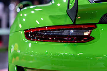 closeup of a red taillight on a luxury sport car, detail on the rear light of a car