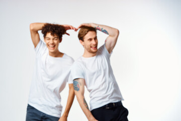 Fototapeta premium two men in white t-shirts are standing next to friendship emotions