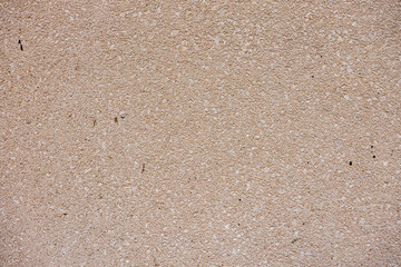 Natural beige stone wall texture and background