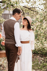 Portrait of a romantic man holding his girlfriend's hand.