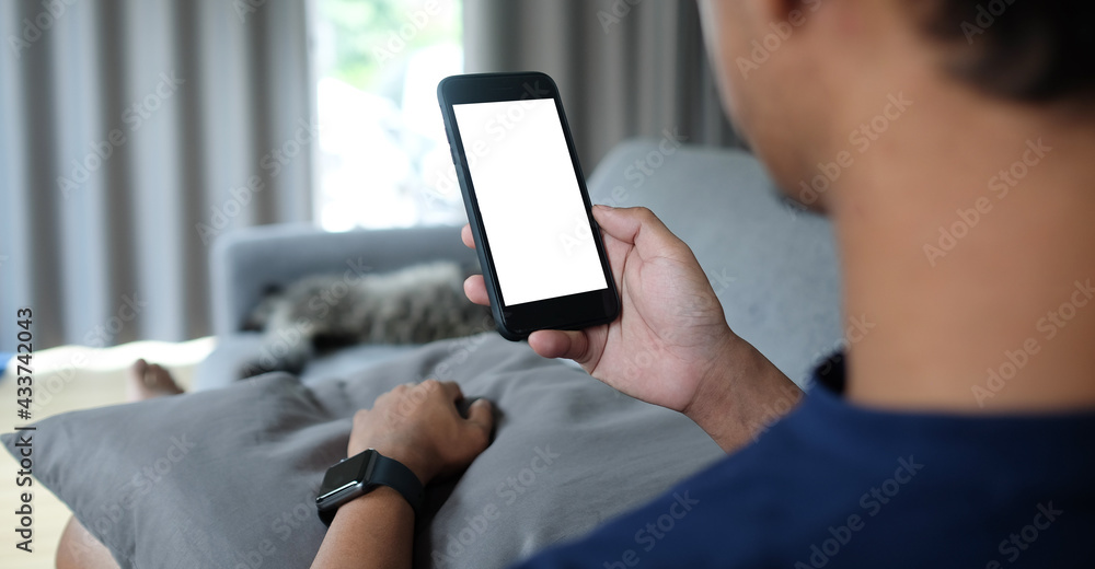 Wall mural cropped shot view of man hands holding smart phone with blank copy space screen for your text messag