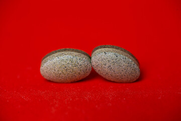 vitamins close-up for health on a red background