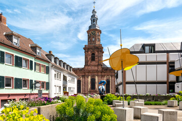 Idyllic place to rest at the Schlossplatz in Worms. In background the Dreifaltigkeitskirche (church)
