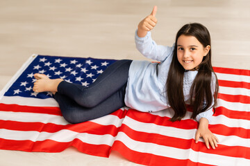 images of lovely little girl over USA flag background