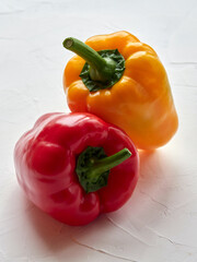 Sweet peppers of red and yellow color on a white background