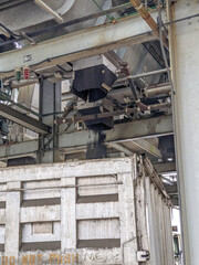 biosolids structure distributing recycled sludge to a dump truck