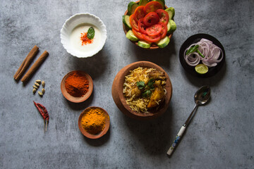 Mughlai cuisine dum biryani or rice cooked with Indian spices and meat. Top view.