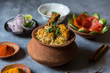 Mughlai cuisine dum biryani or rice cooked with Indian spices and meat. Top view.