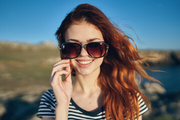 woman with glasses portrait close-up nature landscape lake