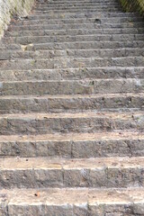 Old and antique stone stairs with sharp steps