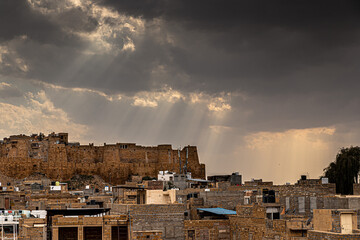 ancient jaisalmer fort of rajasthan with dramatic clouds in background.
