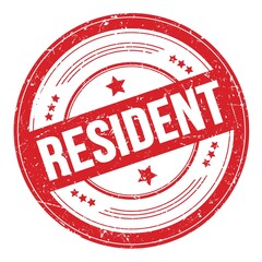 RESIDENT text on red round grungy stamp.
