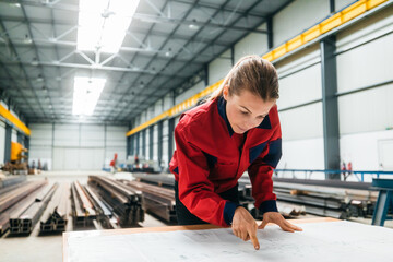 Construction inspector looking at manufacturing building structure.