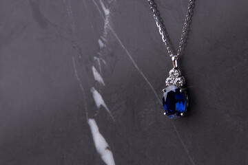 Sapphire pendant with platinum necklace.