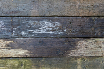 Abstract background of damp stacked wooden railway sleepers covered with frost