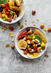 Bowls with various dried fruits and nuts