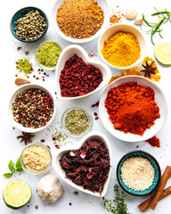 Various spices in a bowls  on white  background. Top view copy space.